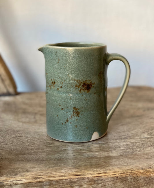 Mid blue jug with glaze detail