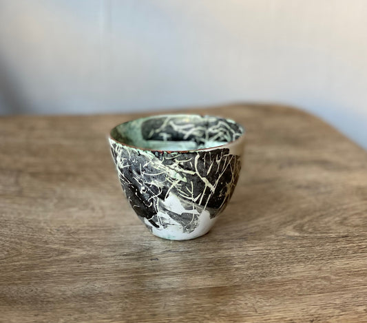 Small decorative vessel with charcoal markings, enamel on copper