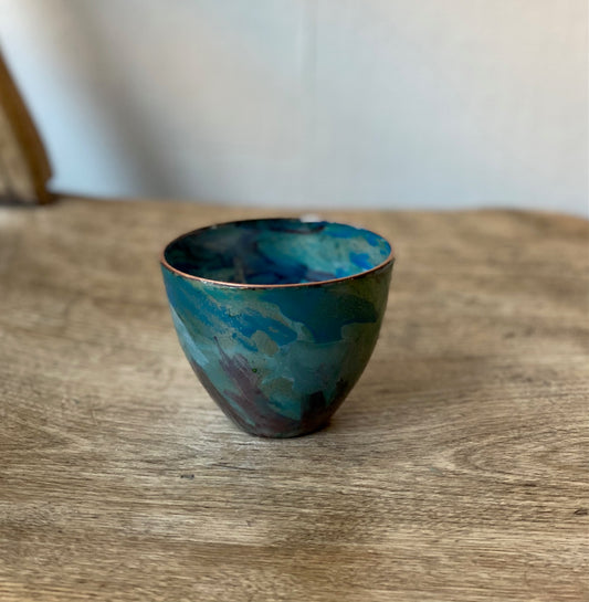 Small decorative vessel with blue details, enamel on copper